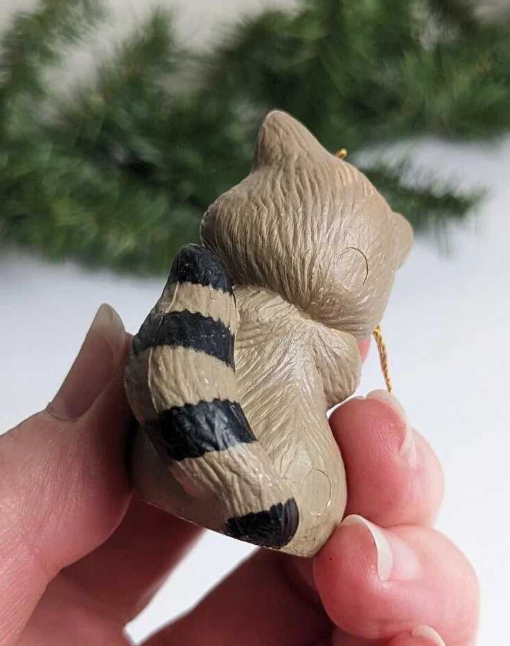 Santa Claus Riding Scooter and Racoon Holding a Stocking Christmas Ornaments