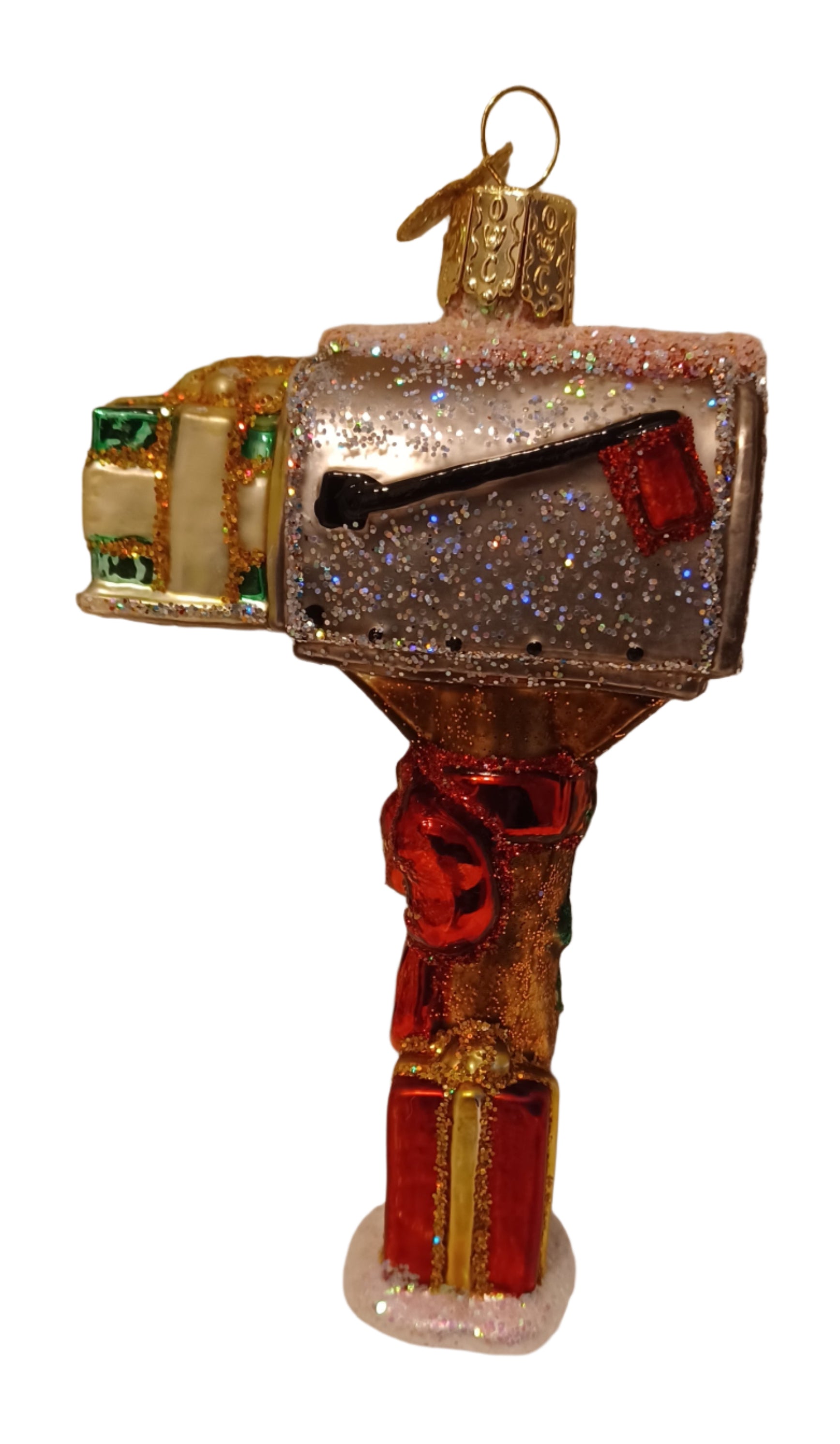 Mouth blown glass ornament of mailbox with gifts and a red flag for outgoing mail. This adorable ornament makes a great stocking stuffer for anyone who works for USPS such as a mail clerk or a mail carrier.