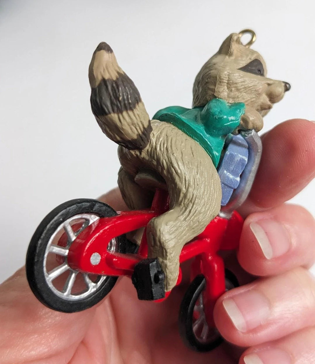 Raccoon Riding a Bike Christmas Ornament