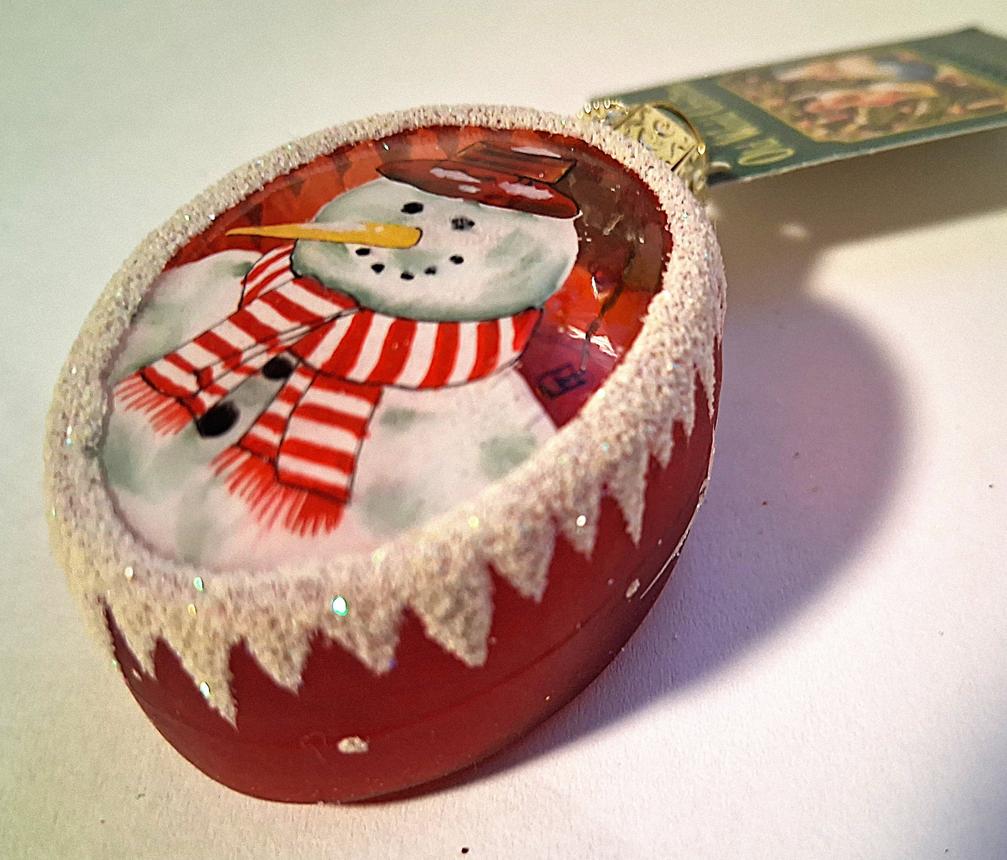 Inside Art Snowman on Red Glass Oval Tree Ornament by Old World Christmas
