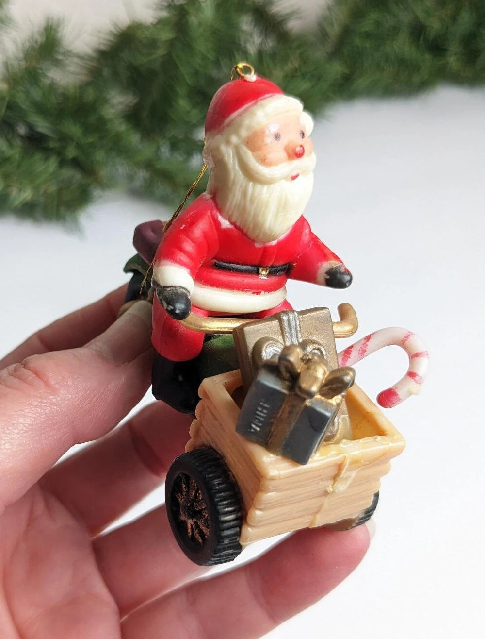 Santa Claus Riding Scooter and Racoon Holding a Stocking Christmas Ornaments