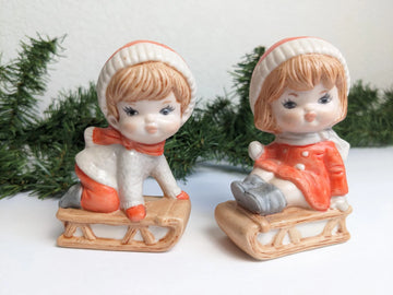 Vintage Boy & Girl Sledding Figurines