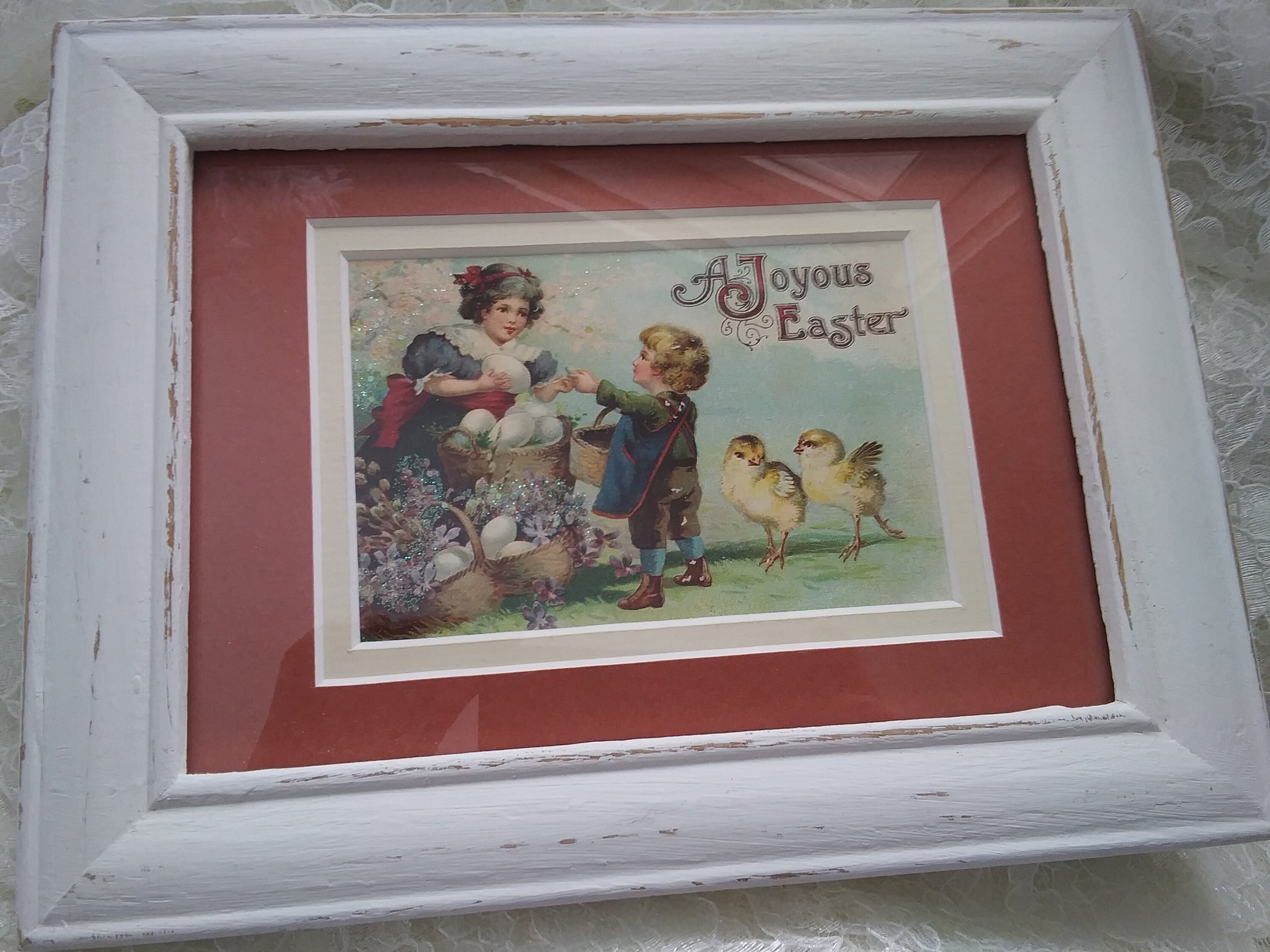 A woman with a basket of ostrich sized eggs interacting witth a small child while to knee high baby chicks frolic nearby. The fantastical sizes of the subjects really add to that early 1900's appeal. 