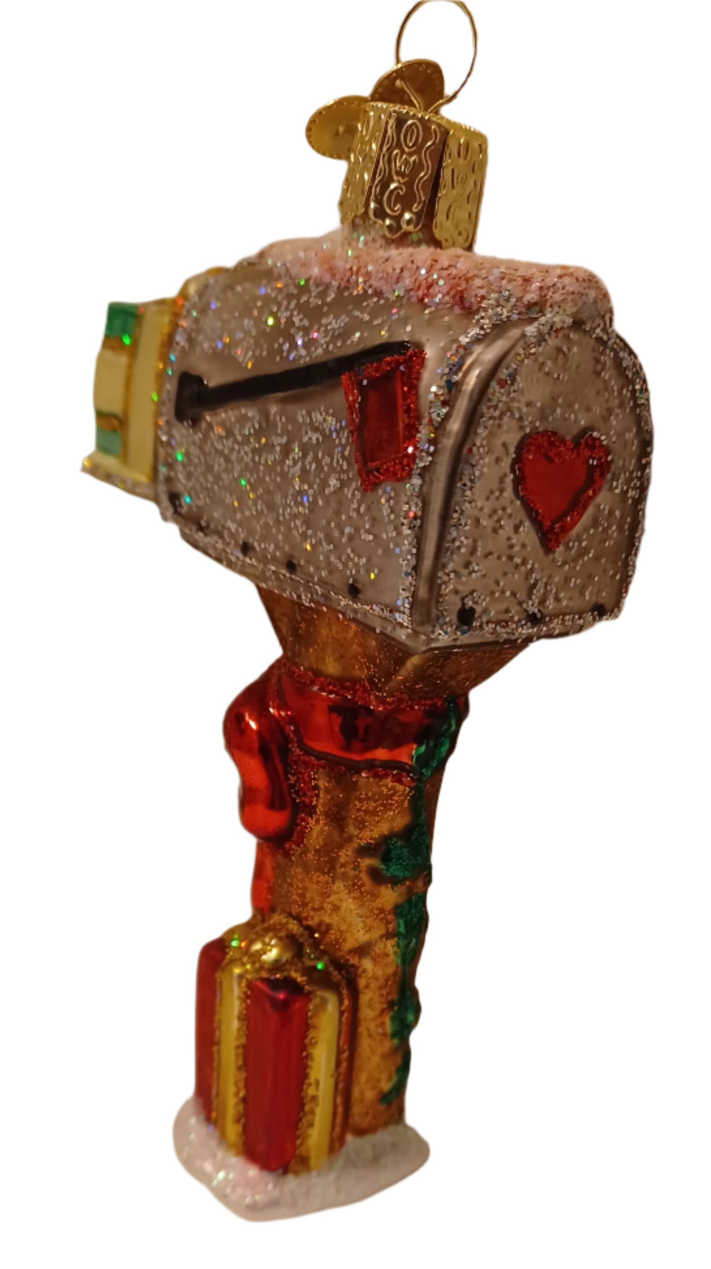 This back view of the mouth blown and silver lined mailbox tree ornament shows a red valentine heart. 