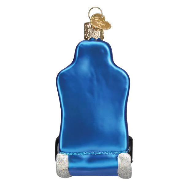 This back view of the gaming chair ornament shows the brilliant blue color of the ornament. And it has the gold heart tag we've come to expect from Old World Christmas tree ornaments. 