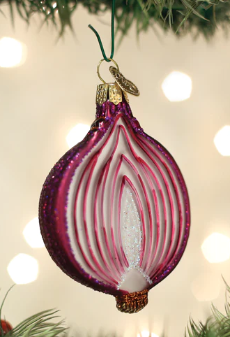 Blown glass ornament in the shape of a red onion cut in half. 