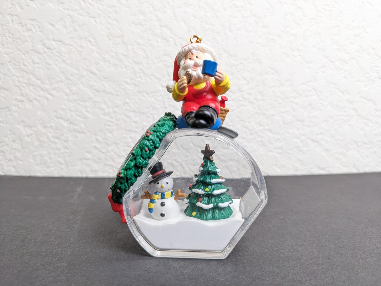 Santa Filling Snow Globe Christmas Ornament