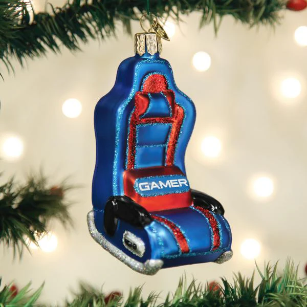 Here we see a picture of the Old World Christmas Gaming Chair glass ornament in its natural environment, hanging on a tree. 