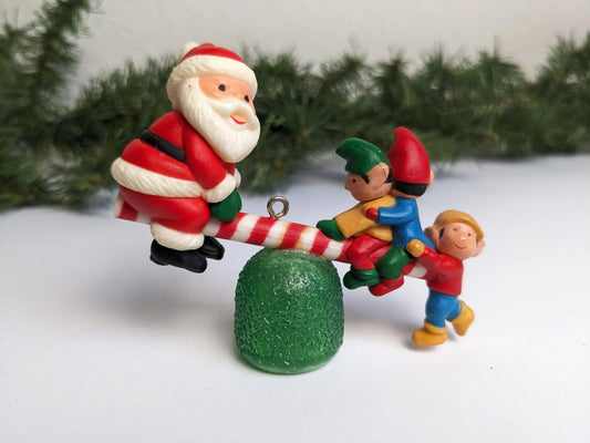 Vintage 1983 Avon Santa's See-Saw Ornament