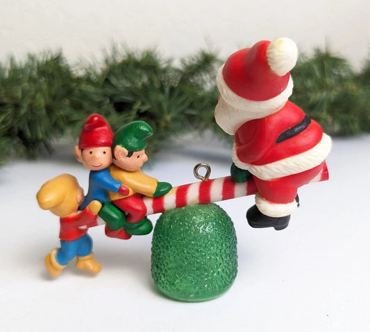 Vintage 1983 Avon Santa's See-Saw Ornament