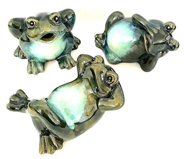 This set of three glazed ceramic frogs add a touch of whimsy.  One looks like it's begging for a treat, the other has a worried expression on its face and the third is kicking back with crossed legs and arms behind its head like it's gazing at the clouds. 